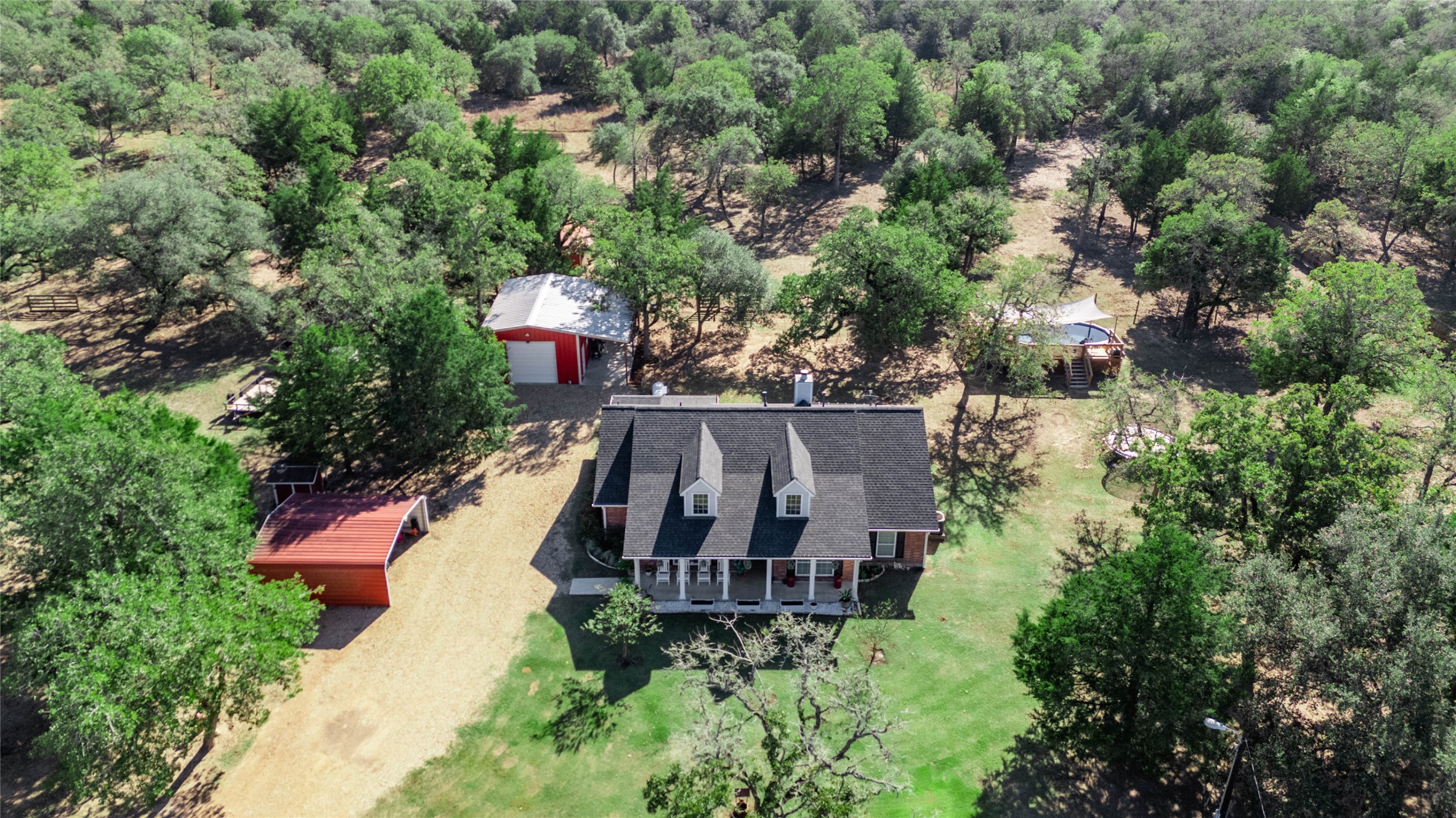 1779 County Road 151 Columbus, TX 78934 - Photo 47 of 47 an aerial view of a house with swimming pool and garden view