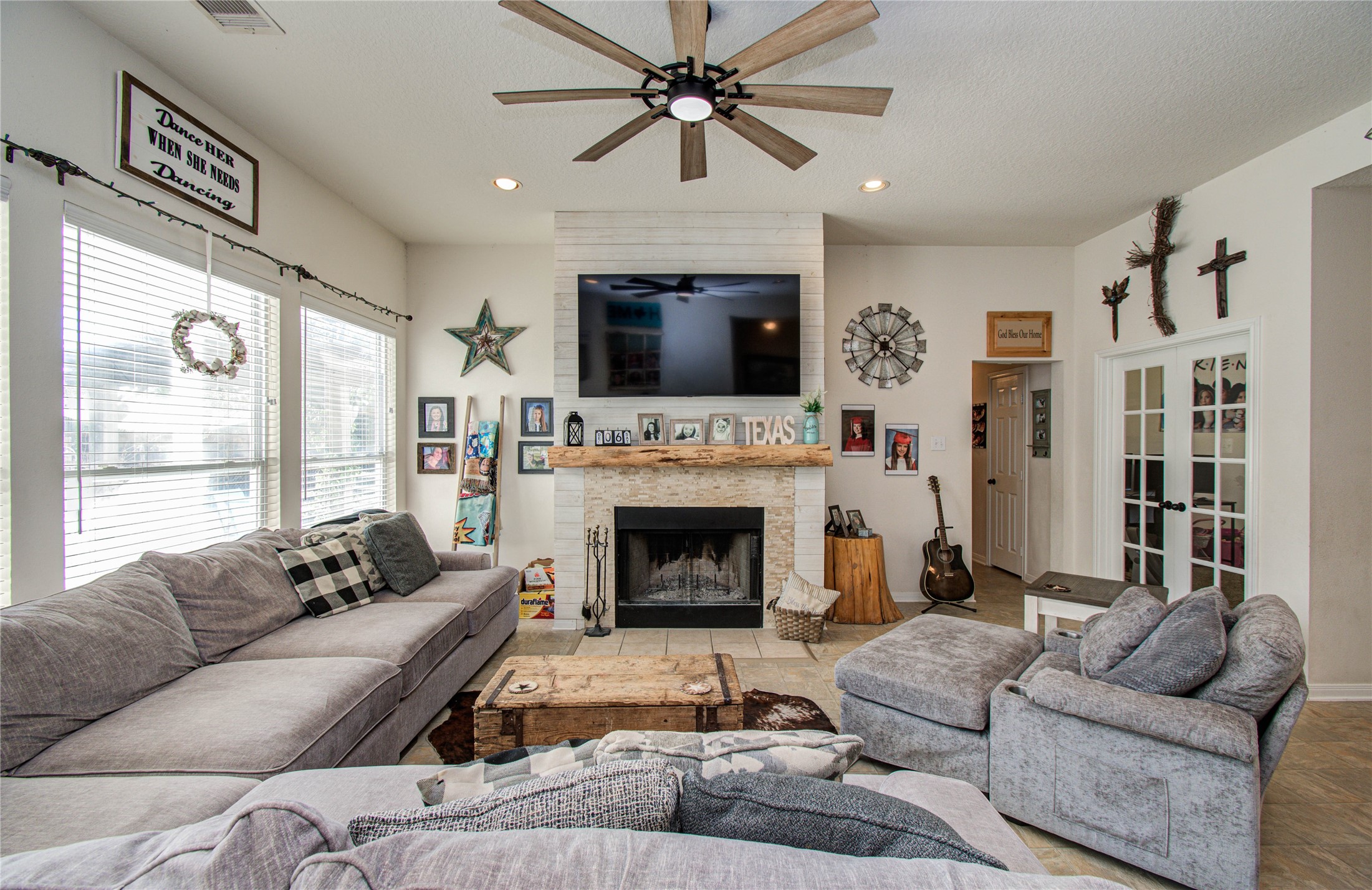 1779 County Road 151 Columbus, TX 78934 - Photo 8 of 47 a living room with furniture a fireplace and a flat screen tv