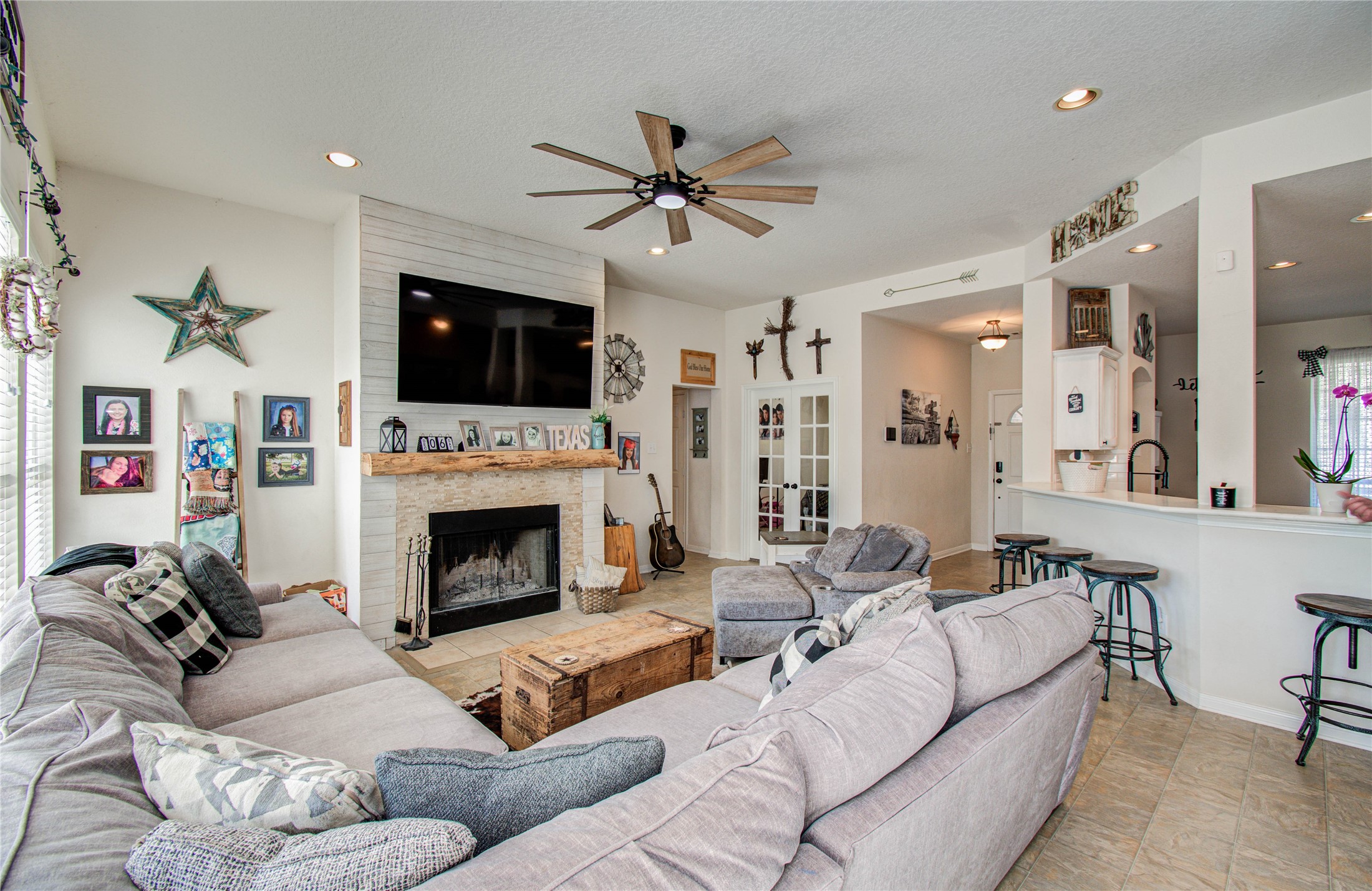 1779 County Road 151 Columbus, TX 78934 - Photo 9 of 47 a living room with furniture a flat screen tv and a fireplace