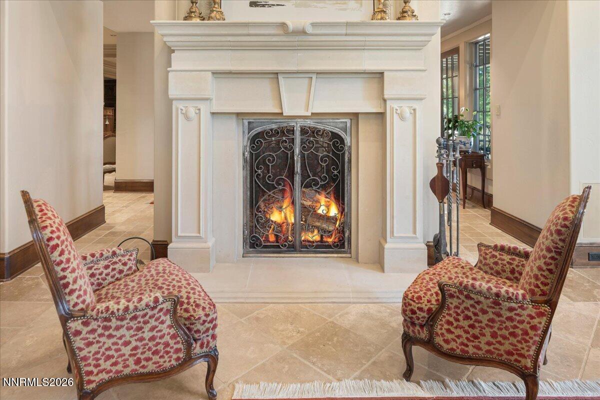 6025 Lake Geneva Drive Reno, NV 89511 - Photo 11 of 72 a living room with furniture and a fireplace
