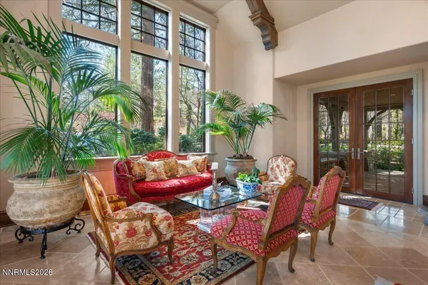a kitchen with stainless steel appliances granite countertop a lot of cabinets