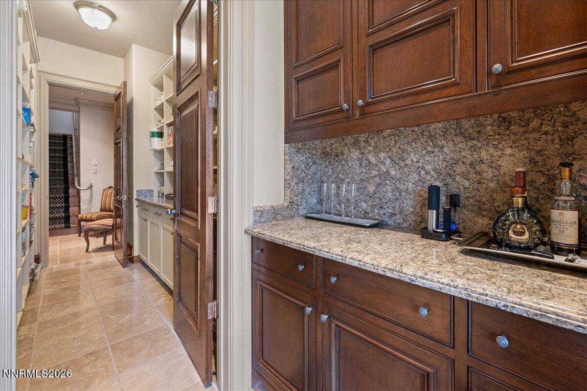 6025 Lake Geneva Drive Reno, NV 89511 - Photo 18 of 72 a kitchen with granite countertop stainless steel appliances a sink and cabinets