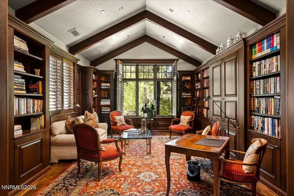 a bedroom with furniture and a window