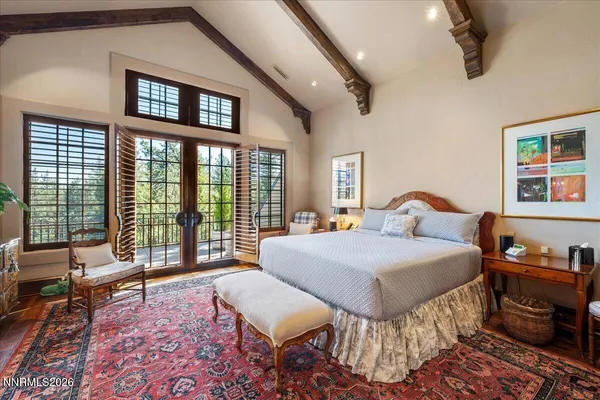 a bedroom with furniture and a window