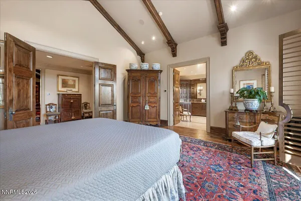 a living room with furniture a flat screen tv and a table