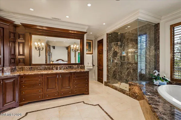 a view of a patio with chairs and table under an umbrella