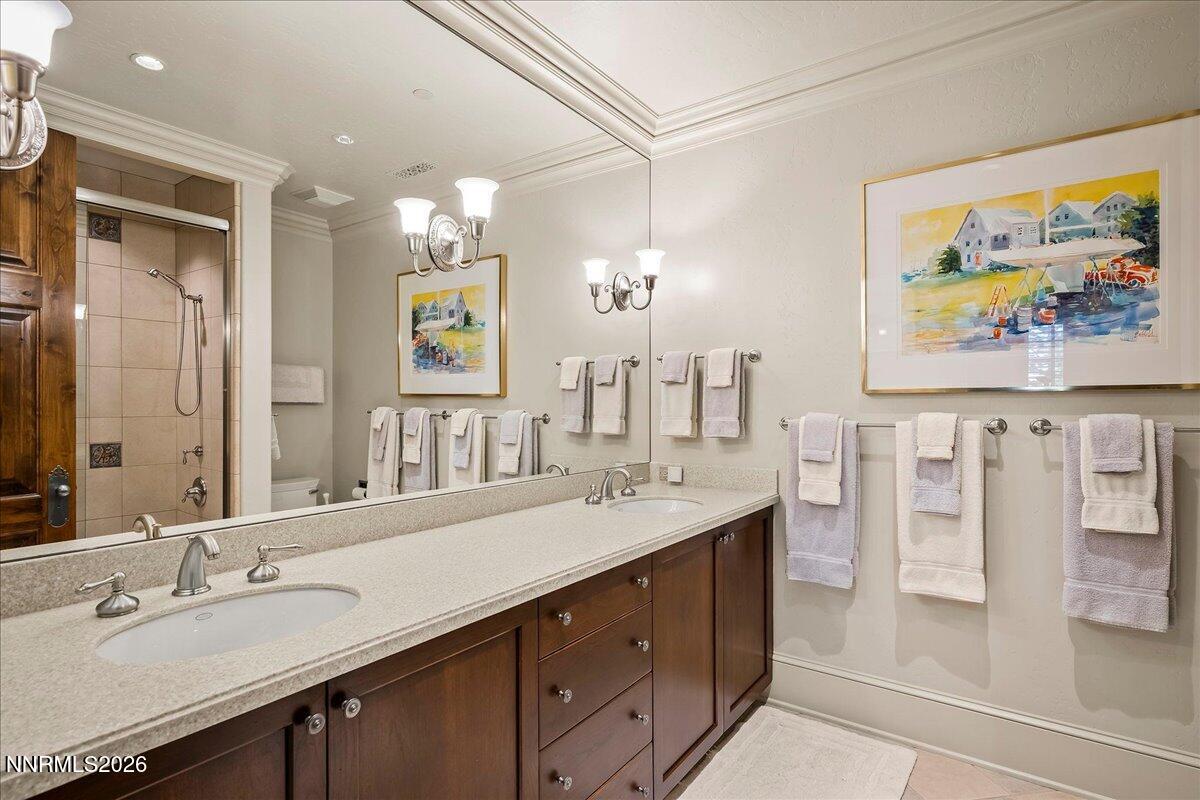 6025 Lake Geneva Drive Reno, NV 89511 - Photo 40 of 72 a bathroom with a granite countertop sink mirror and double