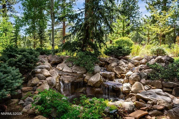 a view of a city with lush green forest