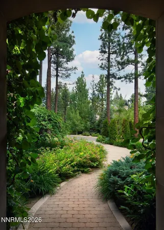 a view of a houses with a lush green hillside
