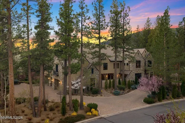 a view of a lush green hillside and houses