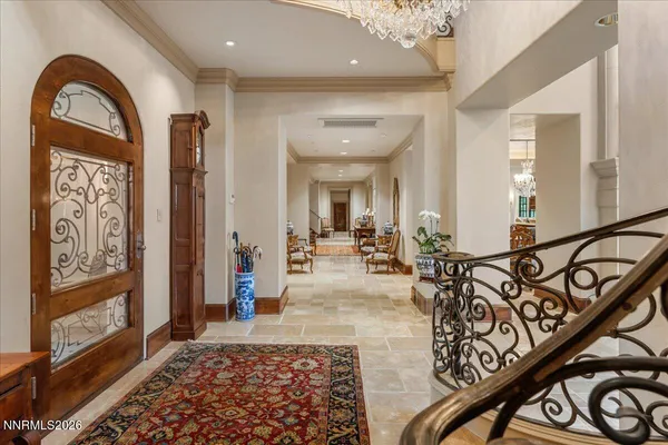 a living room with fireplace furniture and a large window