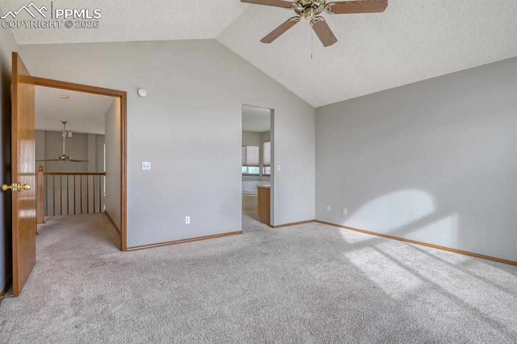 7215 Native Circle Colorado Springs, CO 80919 - Photo 20 of 30 an empty room with fan and windows