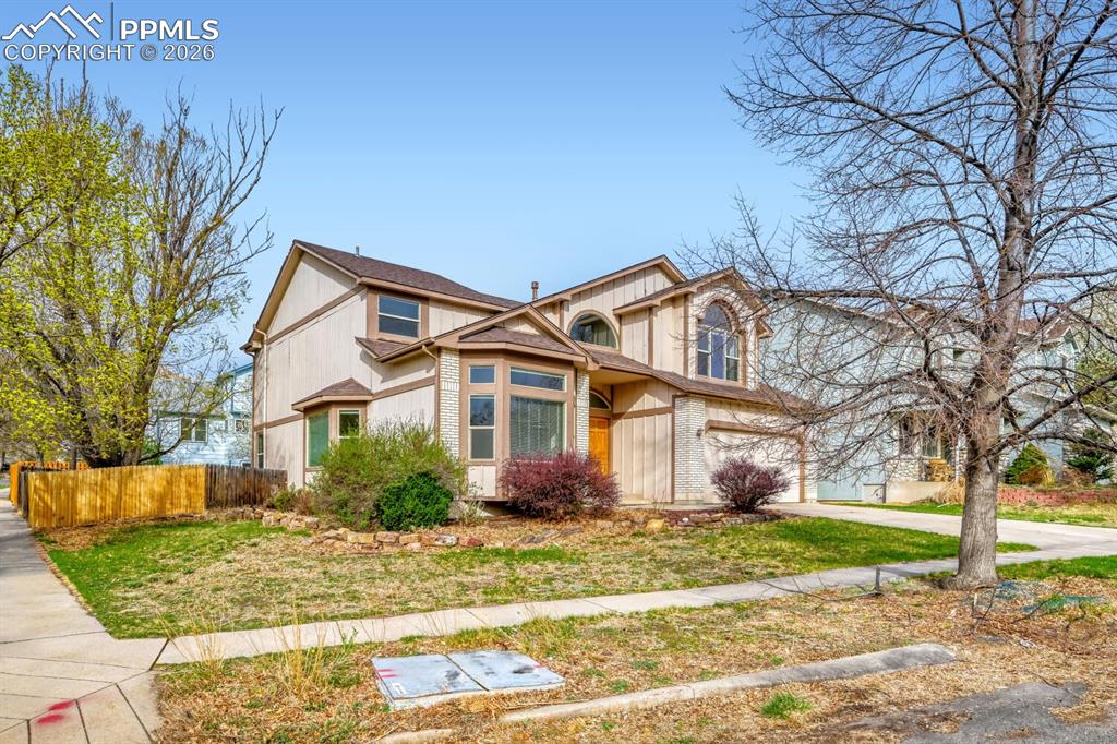 7215 Native Circle Colorado Springs, CO 80919 - Photo 2 of 30 a front view of a house with garden