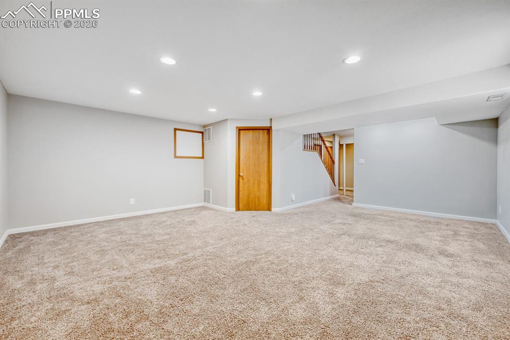 7215 Native Circle Colorado Springs, CO 80919 - Photo 22 of 30 a view of an empty room with a window