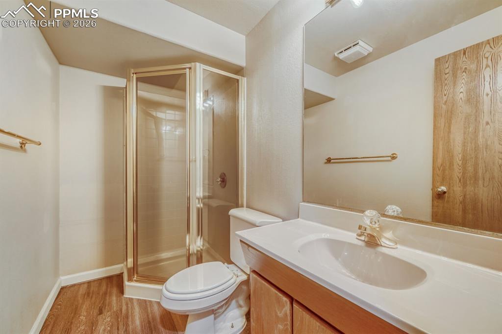 7215 Native Circle Colorado Springs, CO 80919 - Photo 26 of 30 a bathroom with a sink toilet and shower
