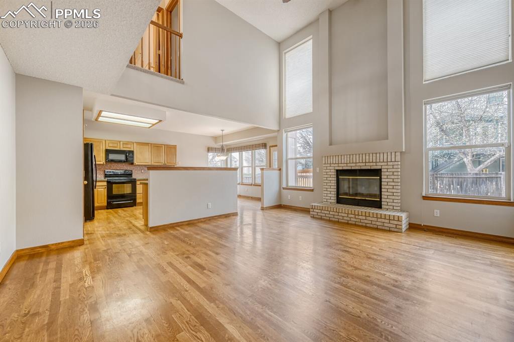 7215 Native Circle Colorado Springs, CO 80919 - Photo 10 of 30 a view of a livingroom with a fireplace