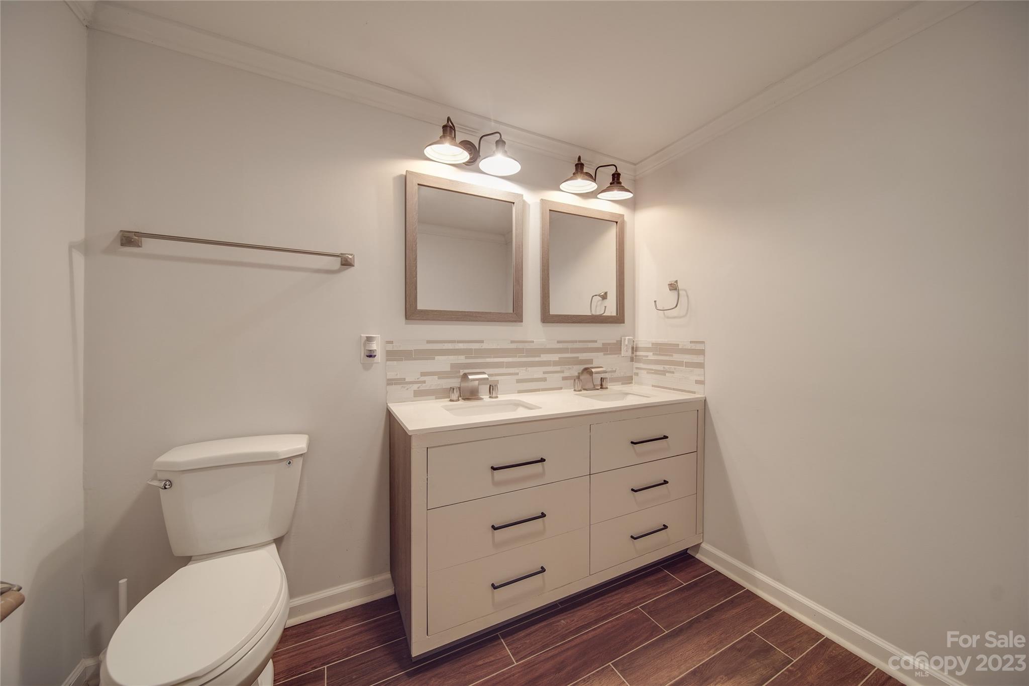 570 Crescent Road Rockwell, NC 28138 - Photo 16 of 28 a bathroom with a toilet sink and mirror