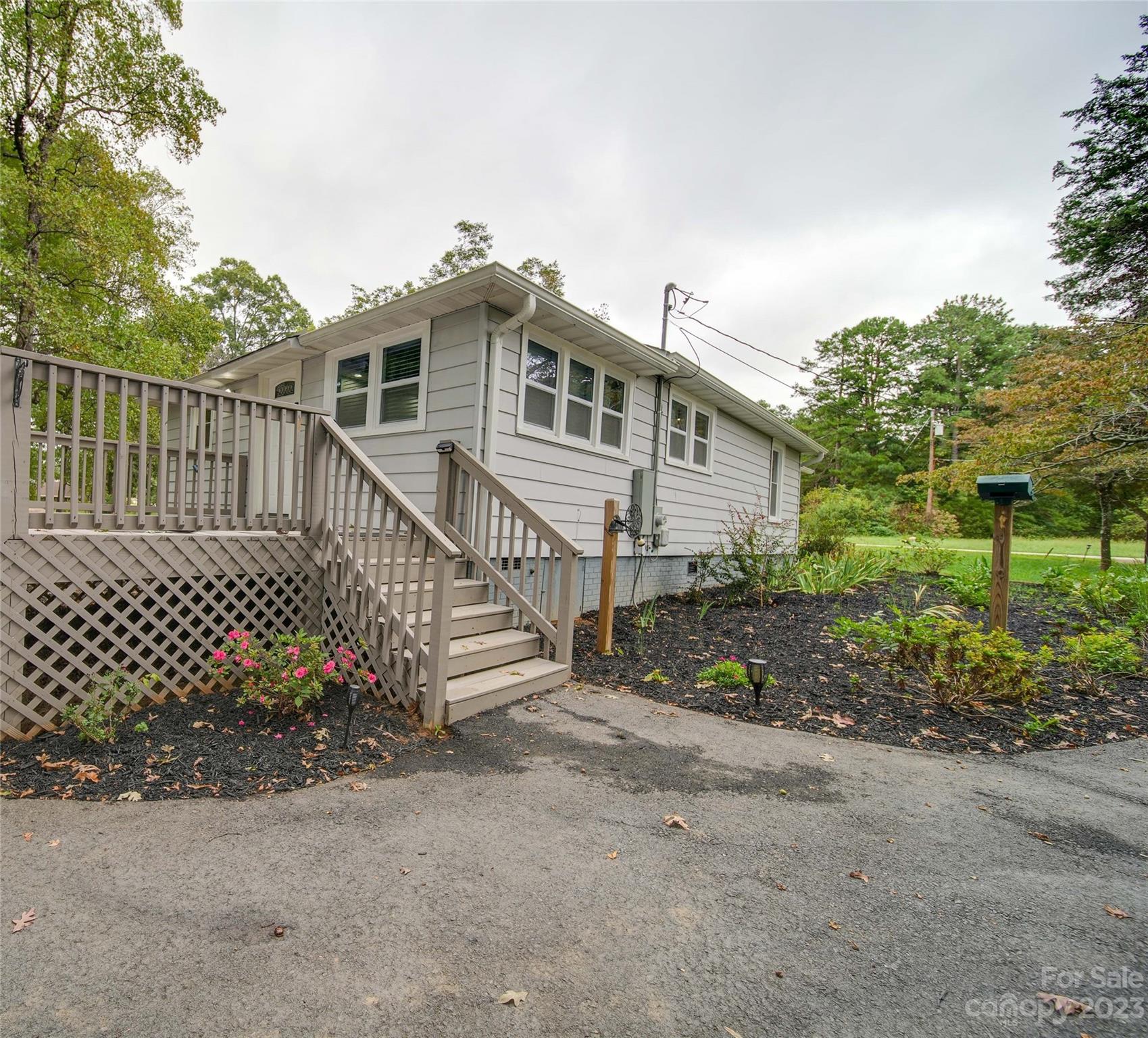 570 Crescent Road Rockwell, NC 28138 - Photo 18 of 28 a view of a house with a small yard and wooden fence