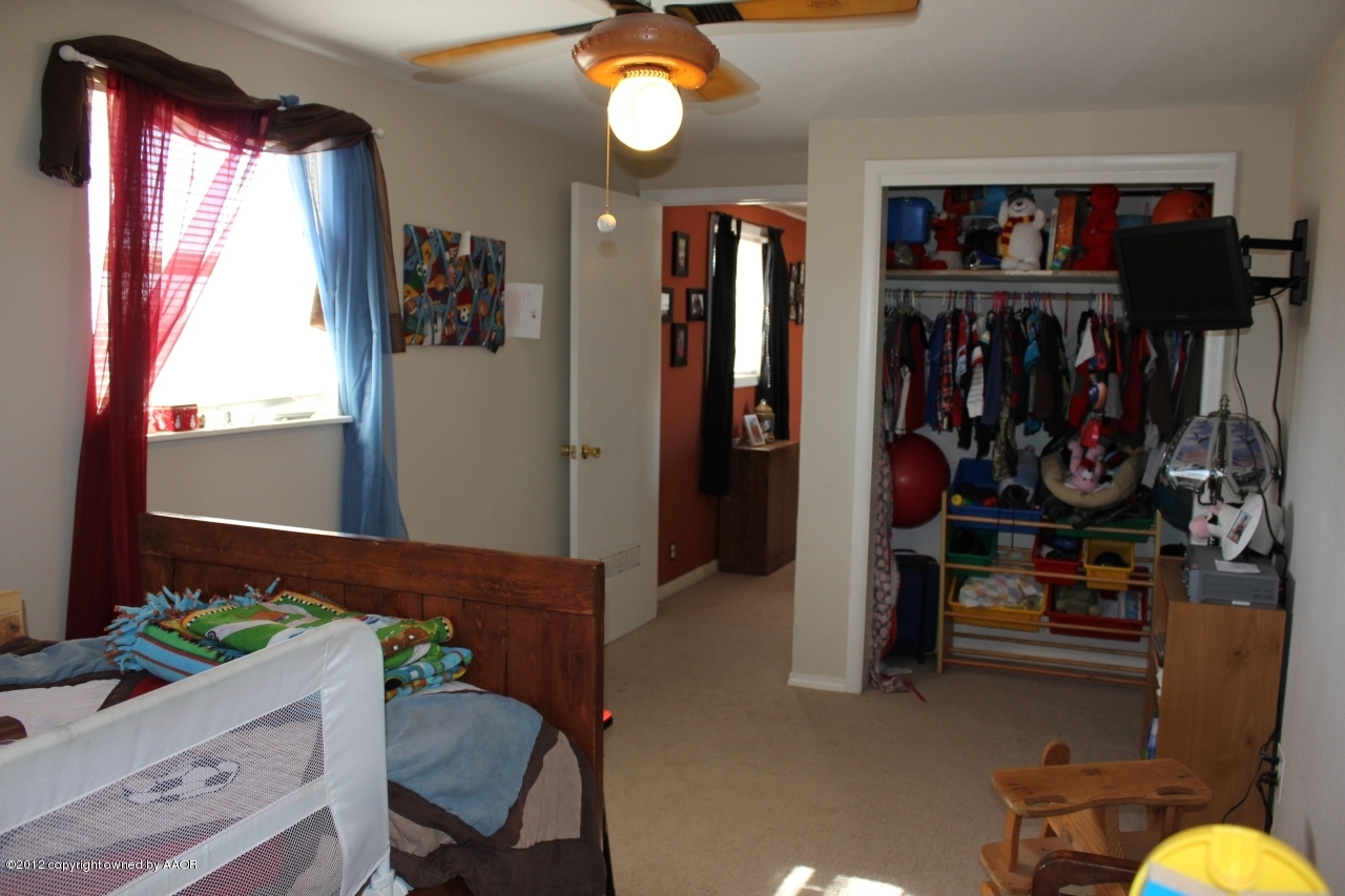 3609 Beacon Road Amarillo, TX 79118 - Photo 16 of 26 a view of a livingroom with furniture and closet