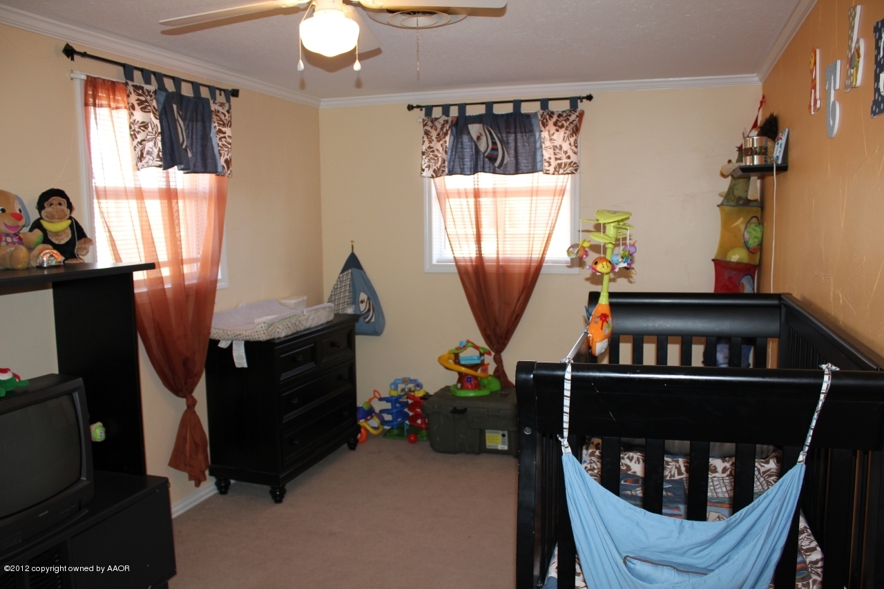 3609 Beacon Road Amarillo, TX 79118 - Photo 20 of 26 a view of a workspace with furniture and a window