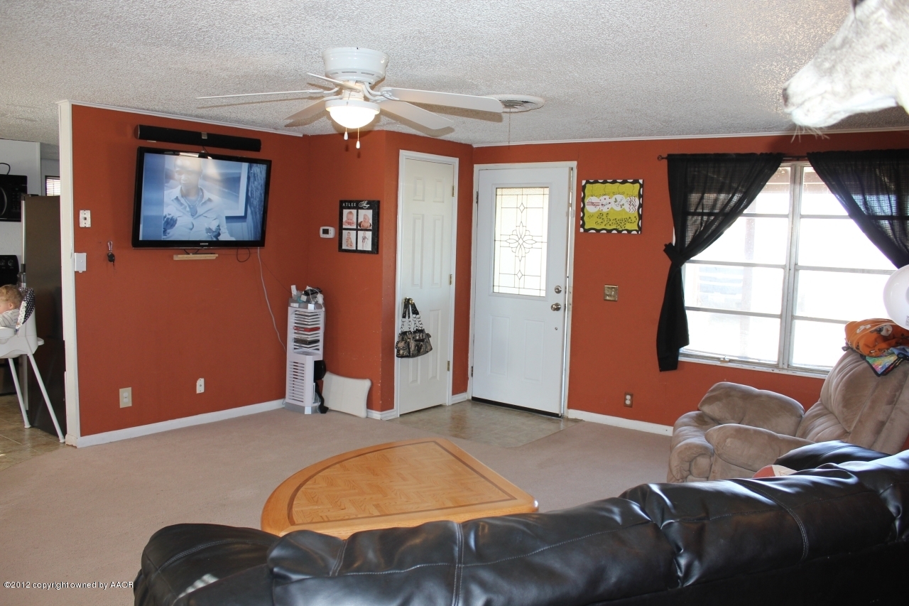 3609 Beacon Road Amarillo, TX 79118 - Photo 2 of 26 a bed room with a bed and a window