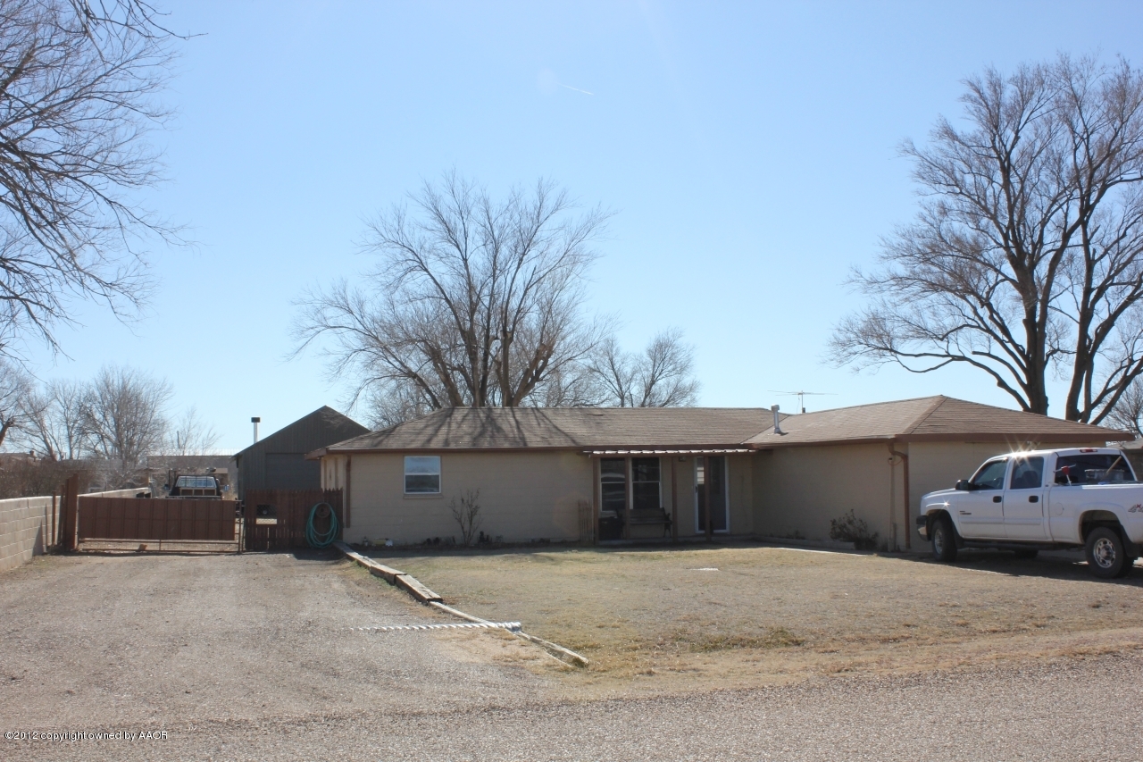 3609 Beacon Road Amarillo, TX 79118 - Photo 7 of 26 a front view of a house with a yard and garage