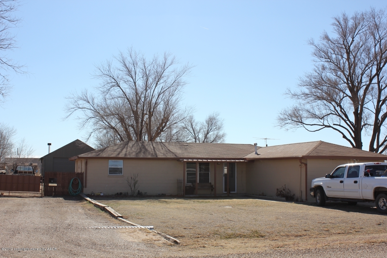 3609 Beacon Road Amarillo, TX 79118 - Photo 8 of 26 a front view of a house with a yard and garage