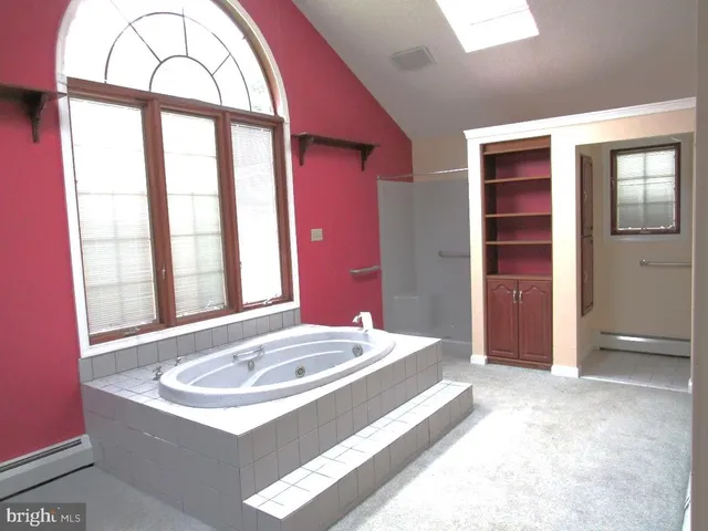 a room with a bed and a window