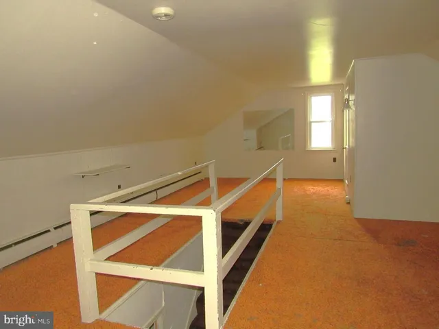 a view of an empty room with windows