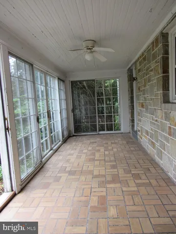 a view of empty room with windows
