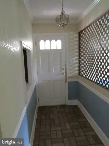 wooden floor in an empty room with a mirror