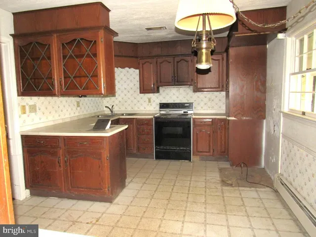 a kitchen with stainless steel appliances granite countertop a sink and cabinets