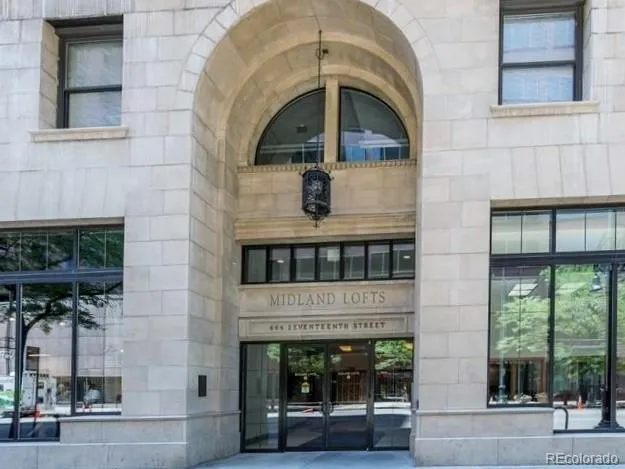 a front view of a building with a porch