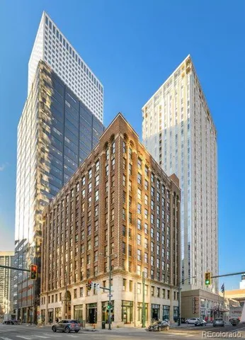 a view of a very nice looking dining room with a window and chandelier