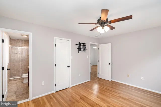 a view of a chandelier fan and entryway