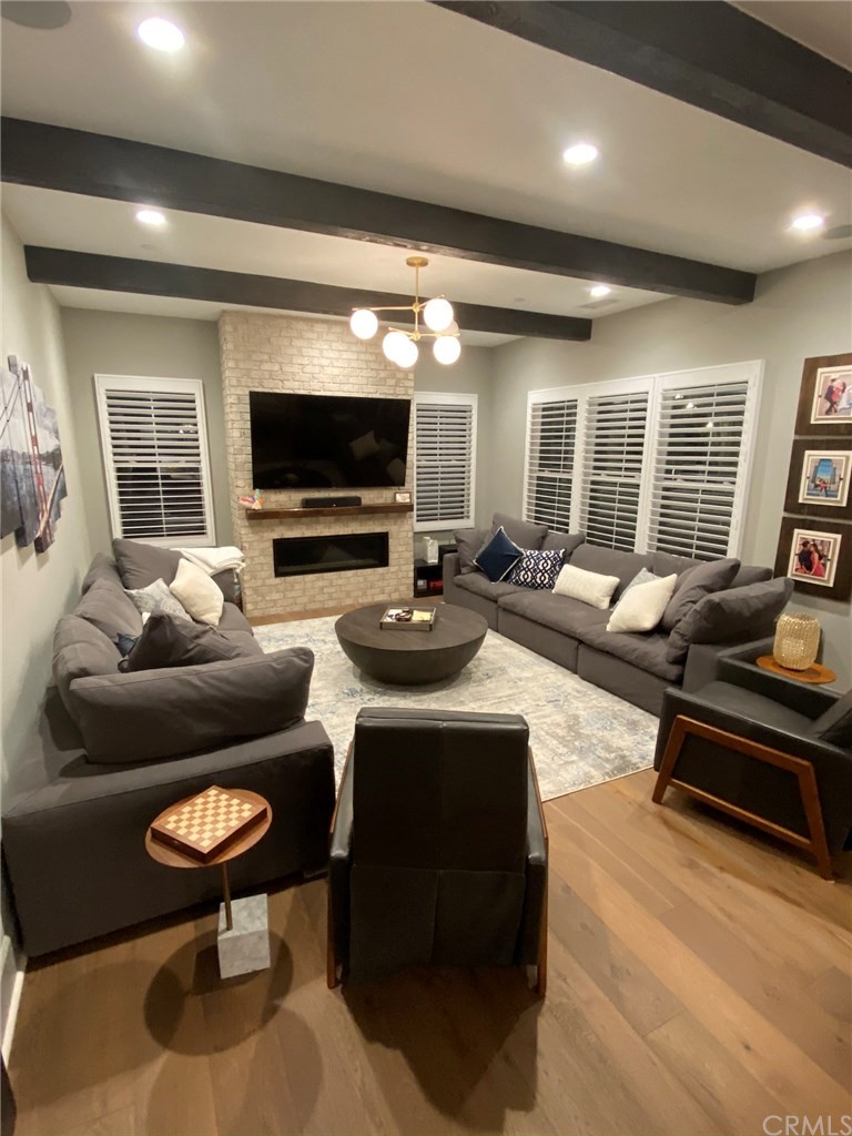 114 Joshua Tree Irvine, CA 92620 - Photo 13 of 73 a living room with furniture and a flat screen tv