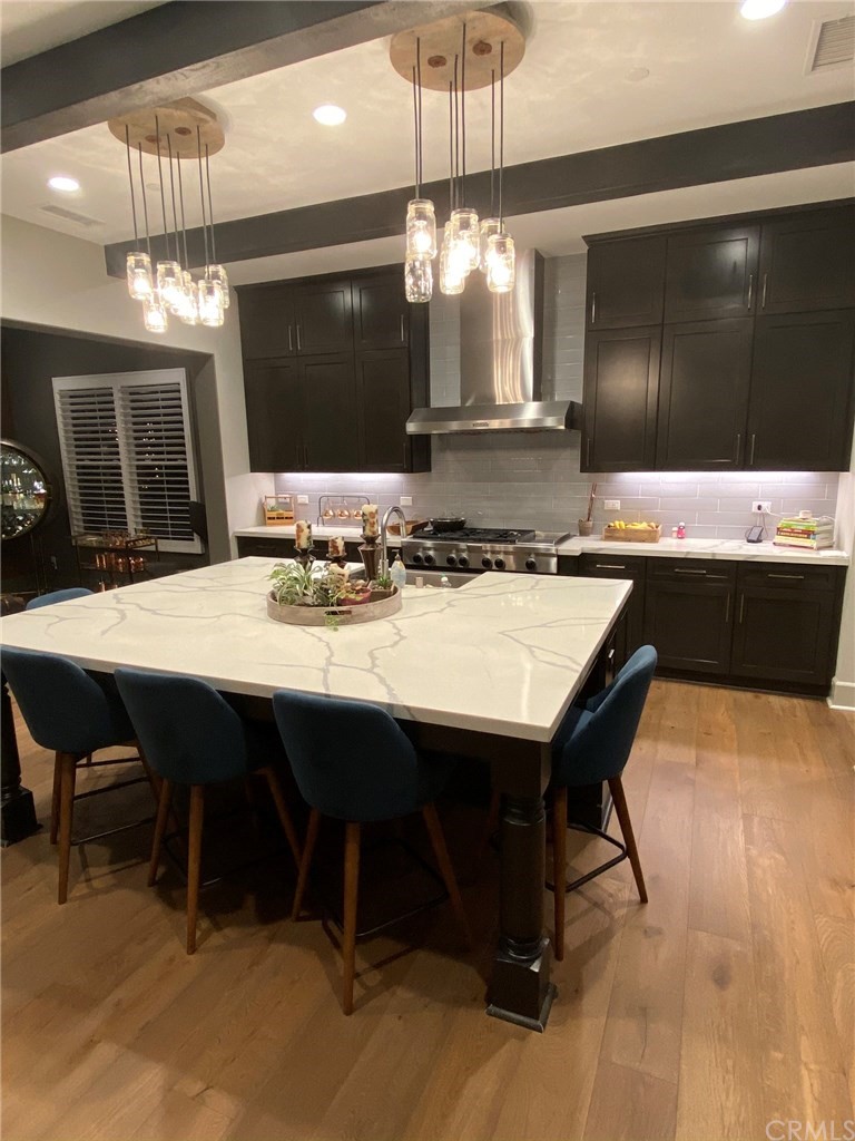 114 Joshua Tree Irvine, CA 92620 - Photo 16 of 73 a kitchen with a counter space a sink and cabinets