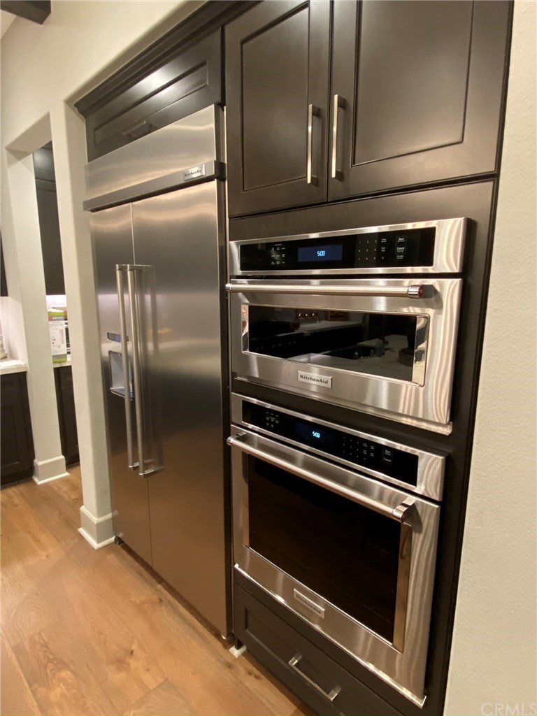 114 Joshua Tree Irvine, CA 92620 - Photo 17 of 73 a stove top oven sitting inside of a kitchen