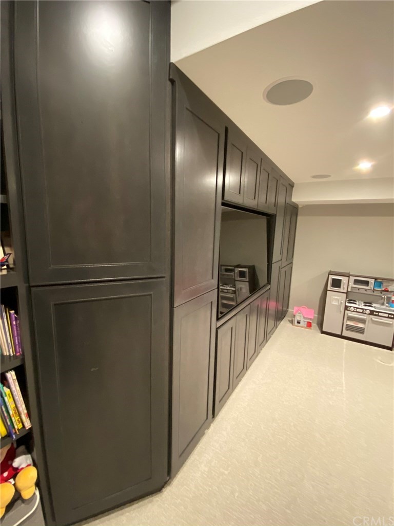 114 Joshua Tree Irvine, CA 92620 - Photo 20 of 73 a hallway with a large window in a kitchen