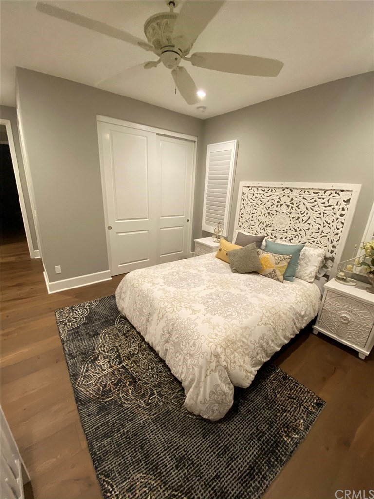 114 Joshua Tree Irvine, CA 92620 - Photo 32 of 73 a bedroom with a bed rug and wooden floor