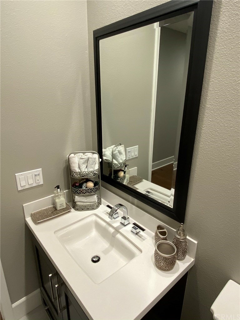 114 Joshua Tree Irvine, CA 92620 - Photo 33 of 73 a bathroom with a sink vanity and a mirror