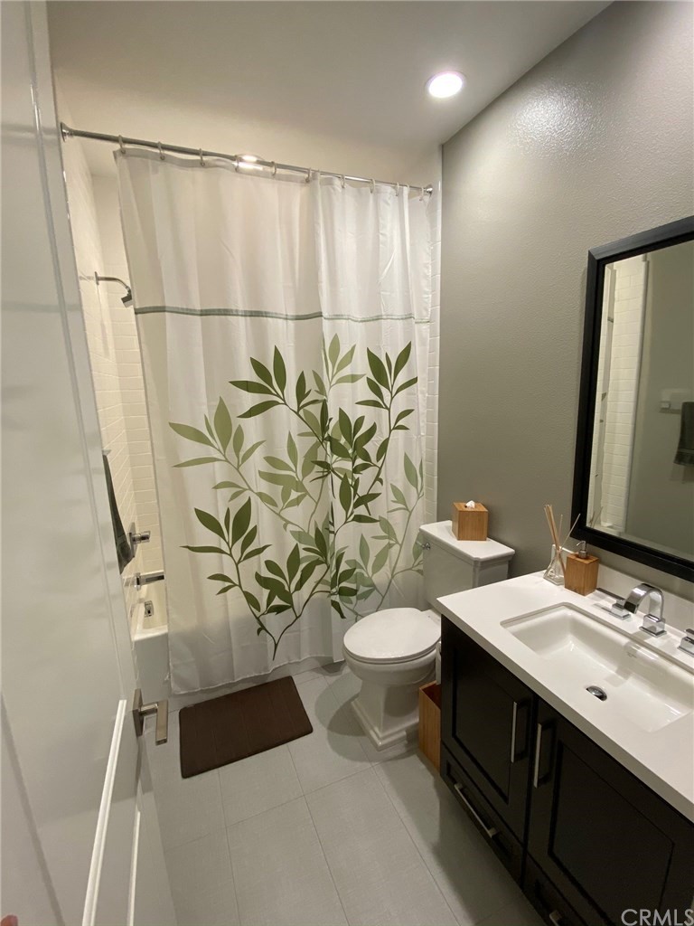114 Joshua Tree Irvine, CA 92620 - Photo 34 of 73 a bathroom with a double vanity sink and a mirror