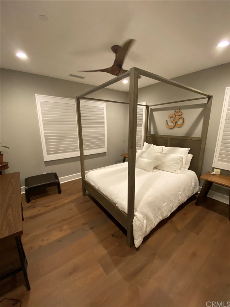 114 Joshua Tree Irvine, CA 92620 - Photo 36 of 73 a bedroom with a bed and a night stand