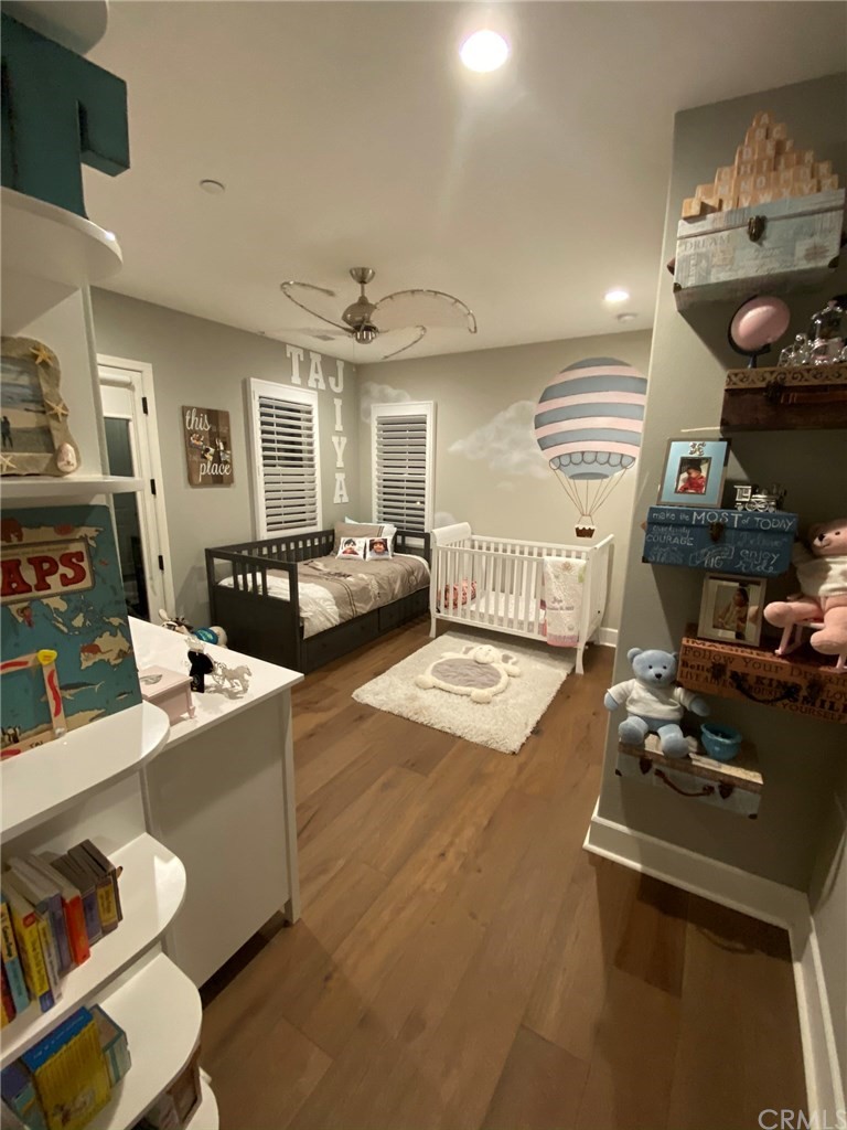 114 Joshua Tree Irvine, CA 92620 - Photo 38 of 73 a living room with furniture and wooden floor