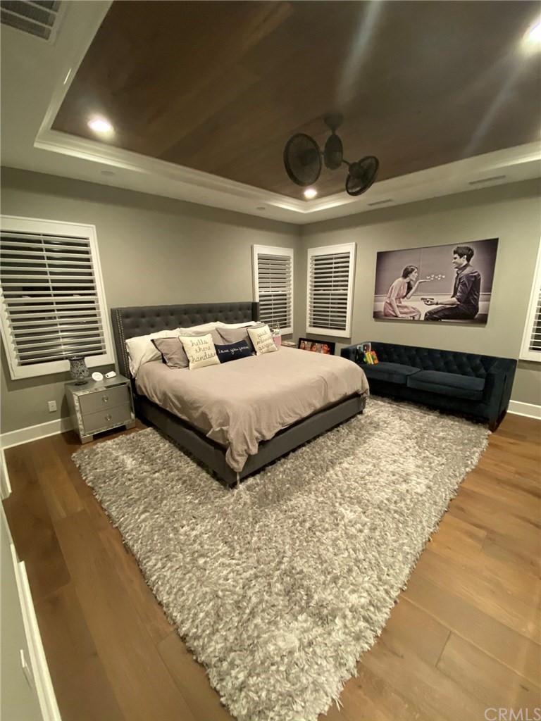 114 Joshua Tree Irvine, CA 92620 - Photo 41 of 73 a bedroom with a large bed and a large window