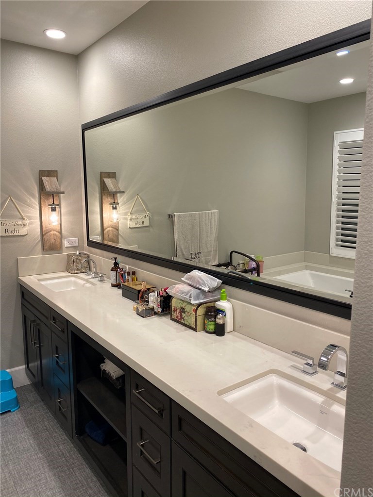 114 Joshua Tree Irvine, CA 92620 - Photo 46 of 73 a bathroom with a sink and a mirror
