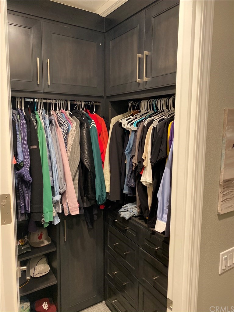 114 Joshua Tree Irvine, CA 92620 - Photo 48 of 73 a view of walk in closet with clothes and shoes