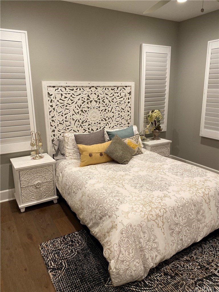 114 Joshua Tree Irvine, CA 92620 - Photo 56 of 73 a bedroom with a bed and wooden floor