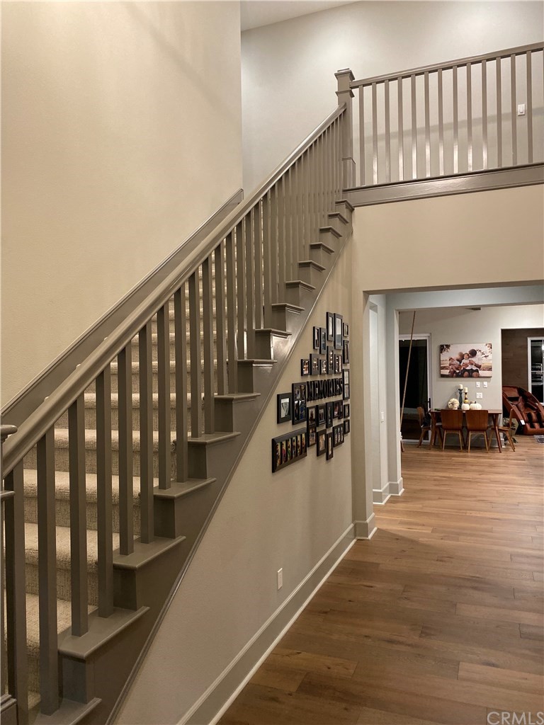 114 Joshua Tree Irvine, CA 92620 - Photo 61 of 73 a view of entryway and hall with wooden floor