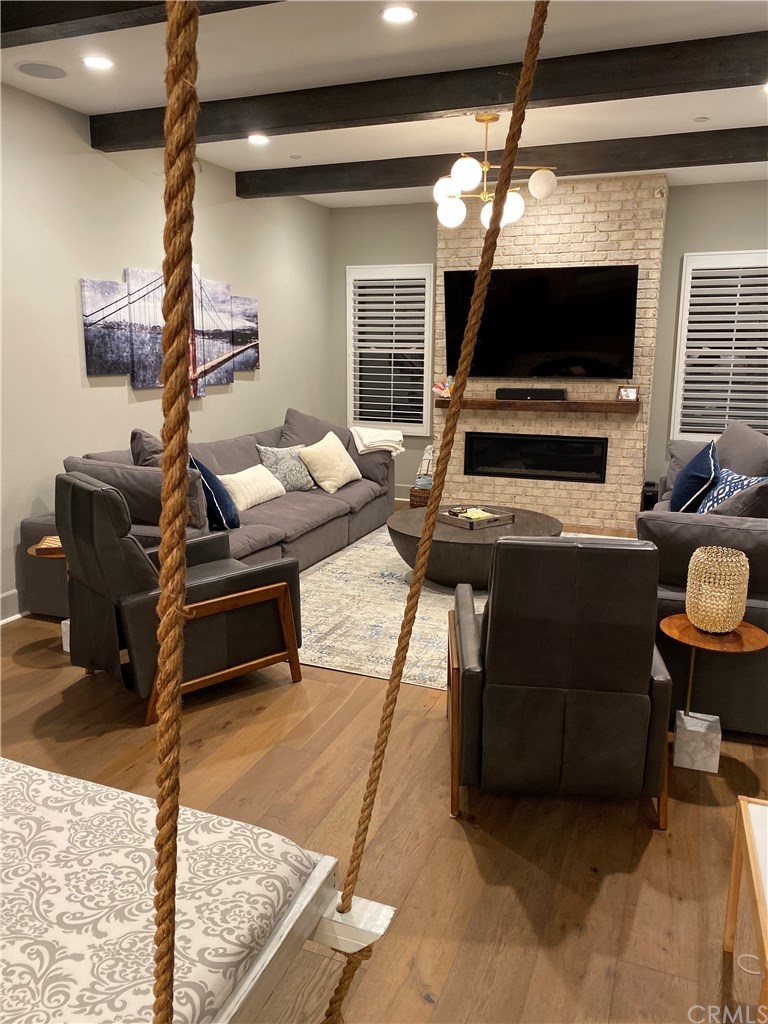 114 Joshua Tree Irvine, CA 92620 - Photo 62 of 73 a room with furniture and a flat screen tv